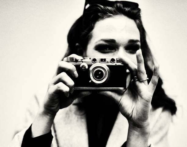 The Photographer Beauty, cute, art, close-up, portrait, fun, young woman, funky, outside, photographer, concentration, fun, shooting, black and white portrait photographers stock pictures, royalty-free photos & images