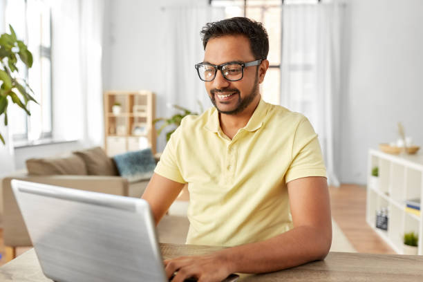 istock indian man with laptop working at home office 1284060875