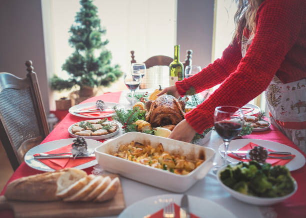 istock Woman arranging Christmas table for celebration. 1284062053