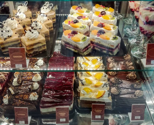 istock Various cake, chocolate and cherry tart toping on fridge display 1284062099