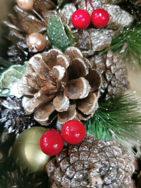 istock pine cones with silver shining and sparkling shapes, berries and snow, selective focus 1284063838
