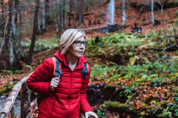istock Woman traveler on a forest trail 1284065077