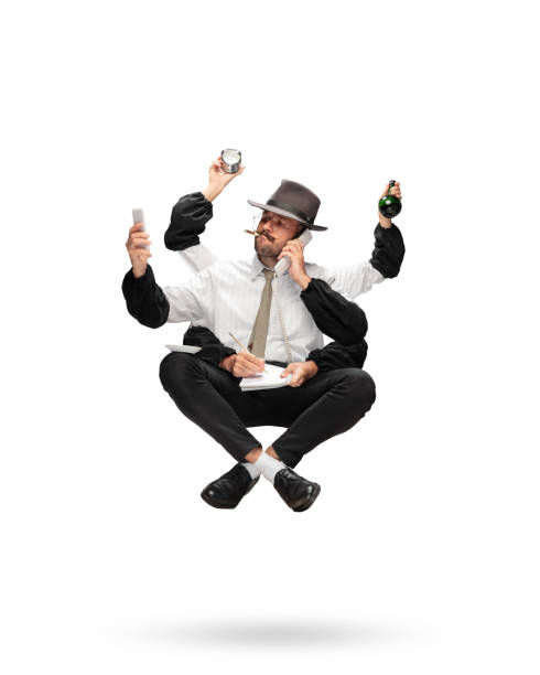 istock Handsome multi-armed journalist levitating isolated on yellow studio background with equipment 1284065594