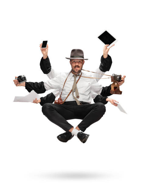 Handsome multi-armed journalist levitating isolated on yellow studio background with equipment