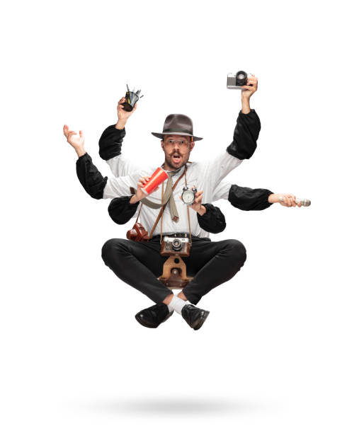 istock Handsome multi-armed journalist levitating isolated on yellow studio background with equipment 1284065601