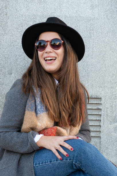 istock young woman with sunglusses,  laughing 1284068953