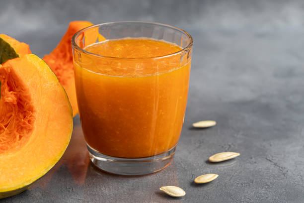 istock Fresh pumpkin juice with cinnamon, autumn drink concept. Vitamin drink. 1284068973