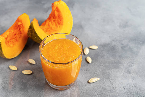 istock Fresh pumpkin juice with cinnamon, autumn drink concept. Vitamin drink. 1284068980