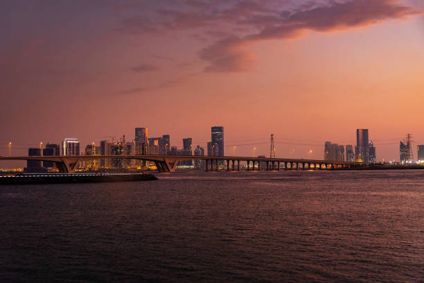 Sunset over Al Reem island in Abu Dhabi United Arab Emirates from the sea