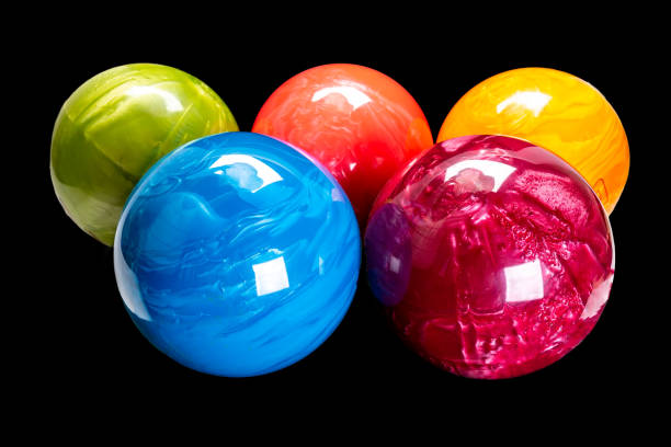 istock colorful bowling balls isolated on black background. 1284069705