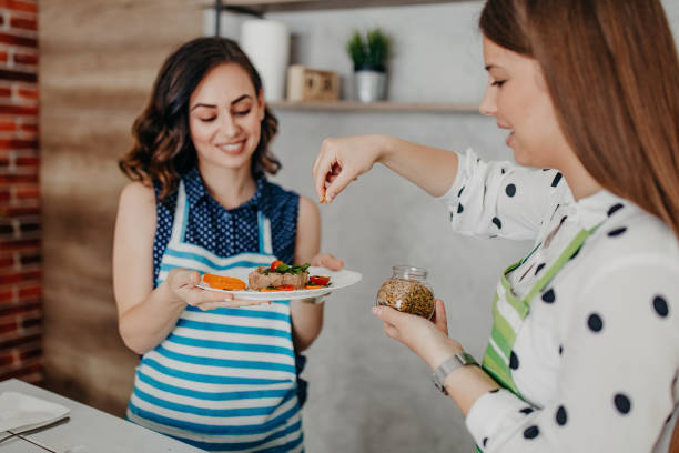 istock Young women preparing food in the kitchen 1284070270