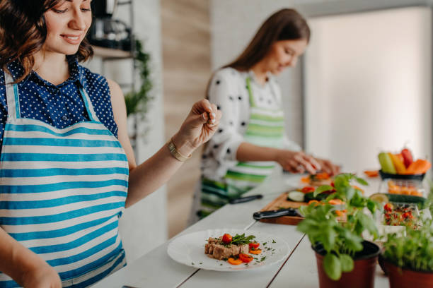 istock Young women preparing food in the kitchen 1284070298