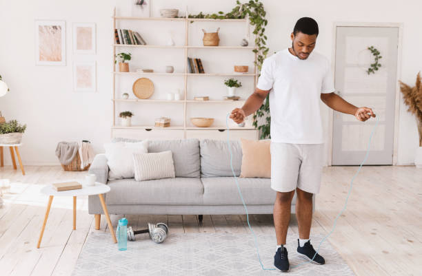 istock African American Guy Holding Jumping Rope Exercising Standing At Home 1284070379