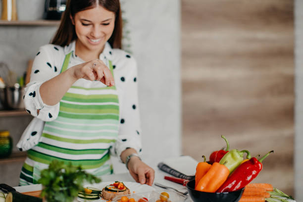 istock Young women preparing food in the kitchen 1284070949