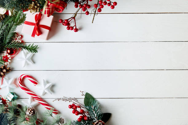 istock Christmas composition. Gifts, fir tree branches, red decorations on white background. Christmas, winter, new year concept. Flat lay, top view, copy space 1284071829