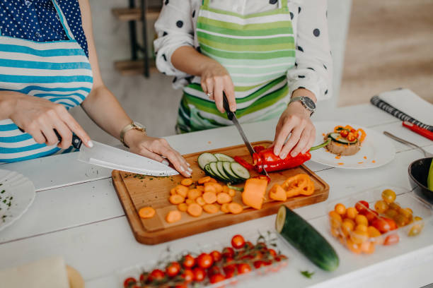 istock Young women preparing food in the kitchen 1284071971