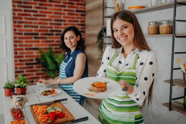 istock Young women preparing food in the kitchen 1284072193