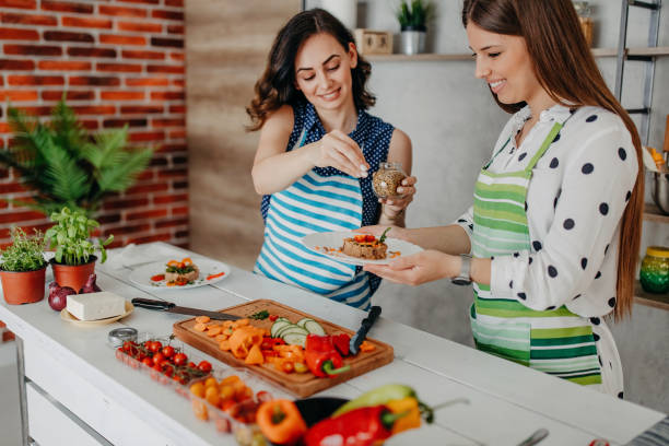istock Young women preparing food in the kitchen 1284072224