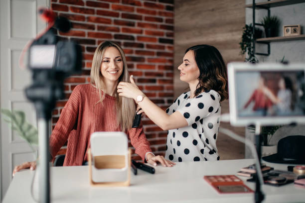istock Two best friends vlogging about hair care 1284073094