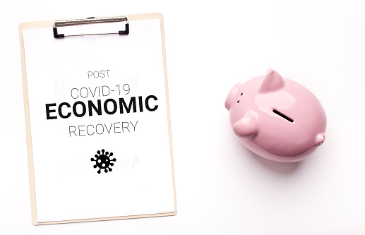 Post Covid-19 Economic Recovery. Conceptual Image With Piggy Bank And Clipboard Flat Laying On White Background, Creative Collage For Coronavirus Financial Crisis Concept, Top View