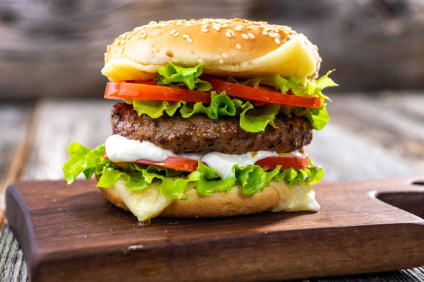 istock hamburger on a wooden background 1284074756