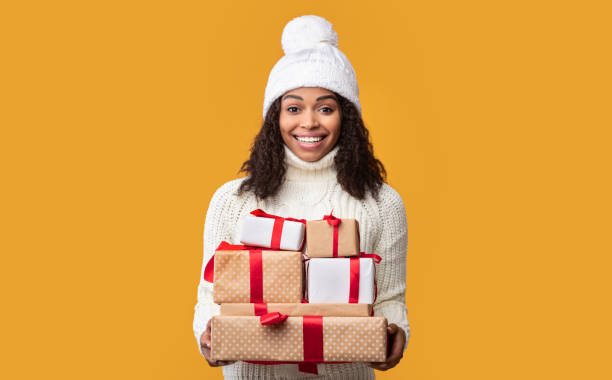 istock African American Woman Holding Many Present Boxes 1284074773