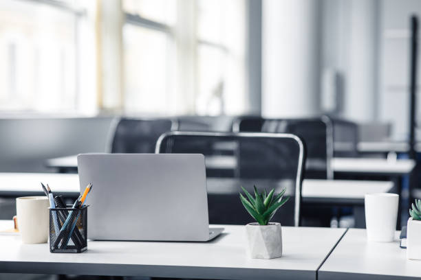 istock Empty space workplace in coworking office during quarantine covid-19 1284075019