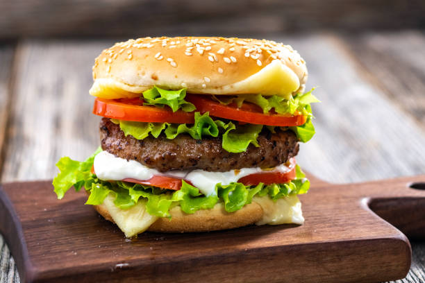 istock hamburger on a wooden background 1284075188