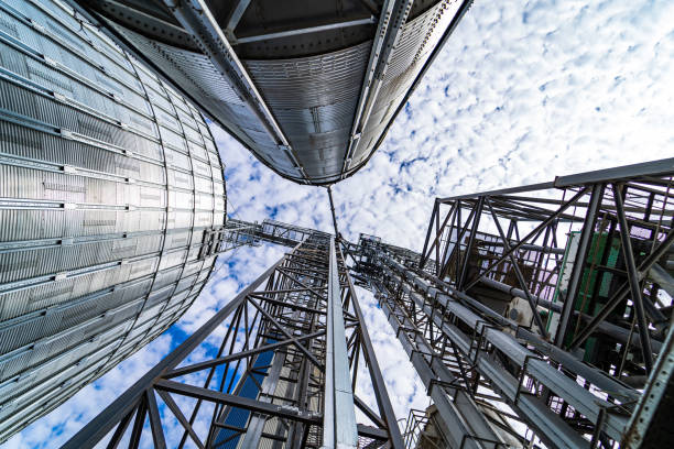 istock View from below on steel grain elevators. Modern up to date factory. Selective focus. 1284075335