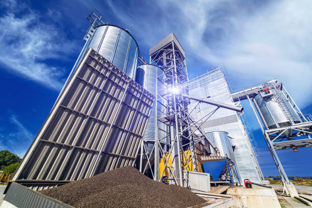 istock Industrial zone with steel grain elevators. Crop storage in tanks. Selective focus. 1284075939