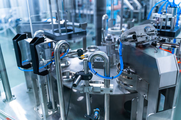 istock Dairy factory with milk pasteurization tank and pipes. Dairy production. Modern equipment. 1284077827