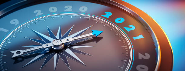 Compass 2020 Dark stylish compass with needle pointing to the year 2021 2021 stock pictures, royalty-free photos & images
