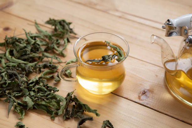 Healthy melissa tea natural organic aromatic drink in glass cup