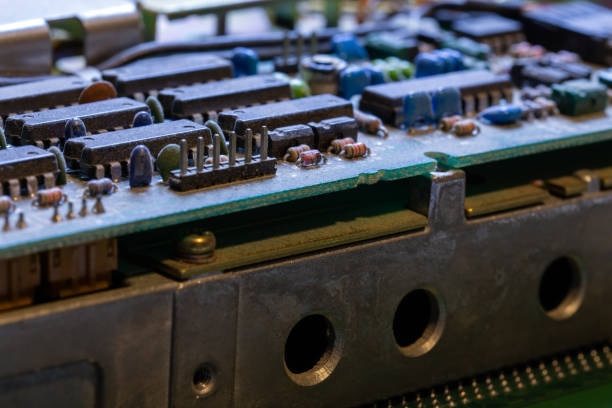 istock dark background of old electronic circuit board closeup with dus 1284080905