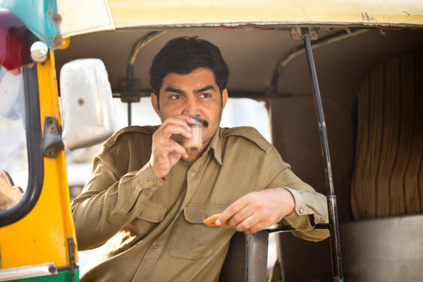 istock Rickshaw driver having fried puri with a cup of hot tea 1284082183