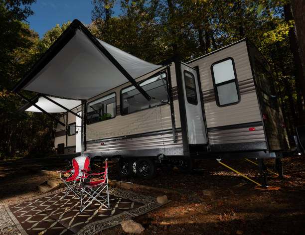 istock Travel trailer in camp as darkness falls 1284085363