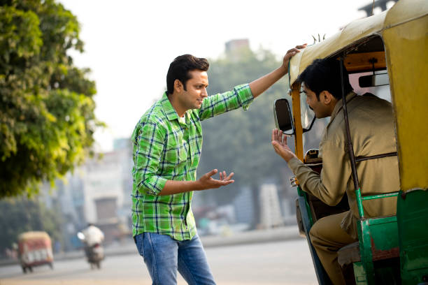 istock Man hailing auto rickshaw in city 1284086440