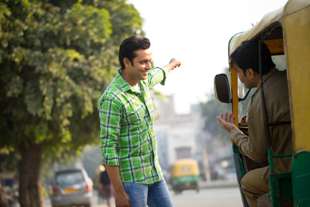 istock Man hailing auto rickshaw in city 1284086459