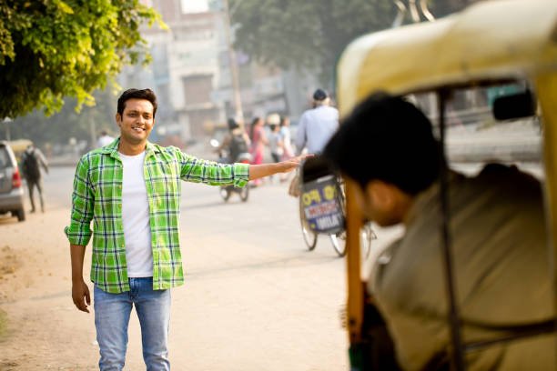 istock Man hailing auto rickshaw in city 1284086594