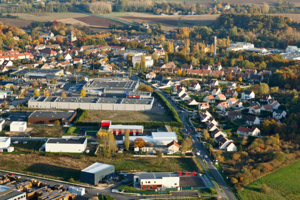 Industrial and commercial aera of Breuillet seen from the sky Breuillet, France - October 30, 2015: Aerial photo of industrial and commercial area of Breuillet, Essonne department, Ile-de-France region. essonne stock pictures, royalty-free photos & images