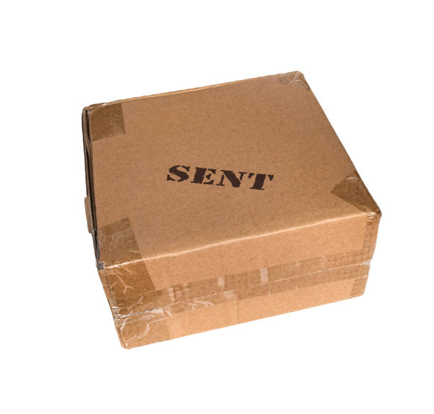 istock Cardboard box on white background with rubber stamp sign sent on the top side 1284088103