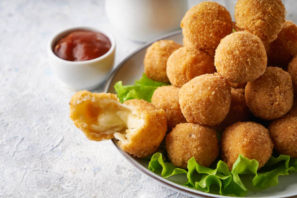 istock cheese balls, appetizer with herbs and sauces in a plate on a gray table 1284088633