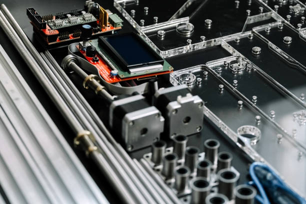 istock a set of parts for a laser machine on a black background, silver backlight, flat lay open-source hardware and software board for controlling the machine and v slot aluminum profile lies 1284089487