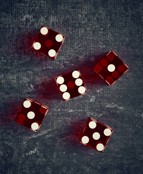 istock Stylized playing dice on dark background, shallow depth of field, top view, close-up 1284089755