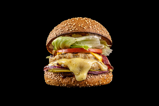 Modern American burgers. Juicy burgers with meat and chicken cutlet, grilled on an open fire.