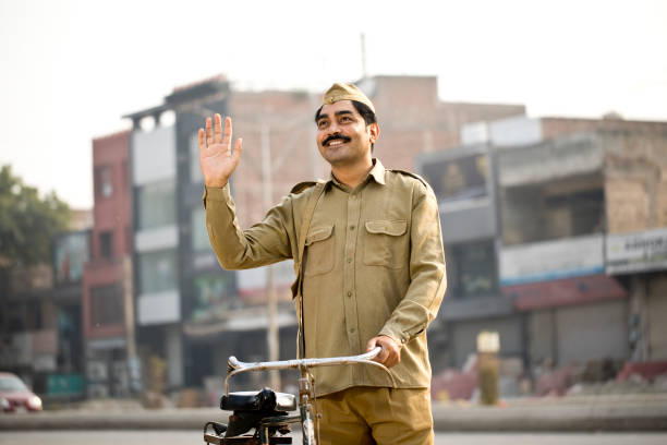 istock Postal worker with bicycle on street 1284091149
