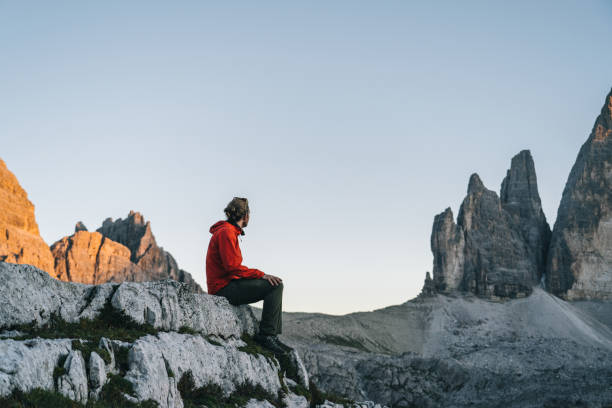 istock Male hiker relaxes on mountain ridge crest 1284091640