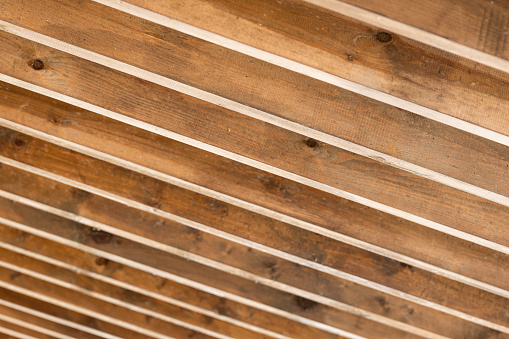 inclined wooden beams, roof of the veranda of a country house