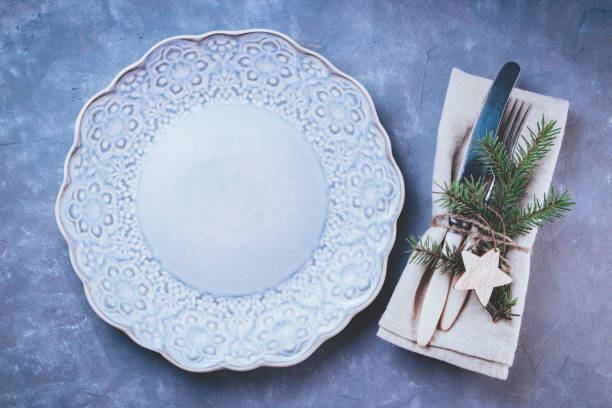 istock Vintage cutlery and empty blue plate - eco friendly new year dinner concept 1284092752