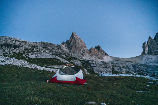 istock Male hiker camps out on mountain ridge crest 1284092769
